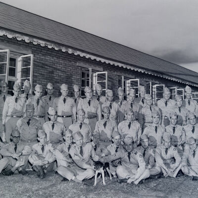 Group of soldiers in front of barracks