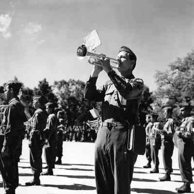 Soldier playing taps