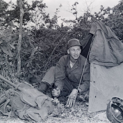 Soldier in front of pup tent
