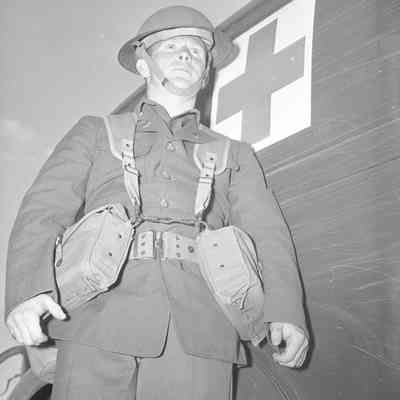 Medic standing beside ambulance