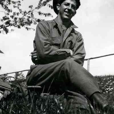 Soldier posing with German cap