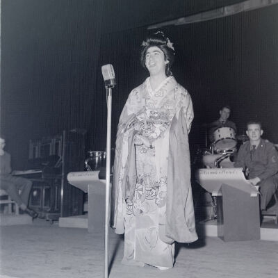 Man dressed as a Japanese woman on stage