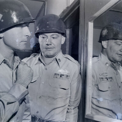 Soldier looking at himself in mirror