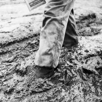 Soldier walking through mud