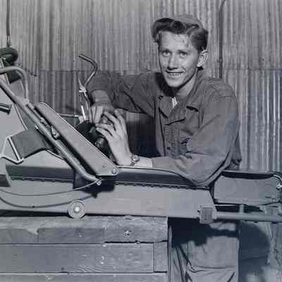 Soldier making repairs to an aircraft seat