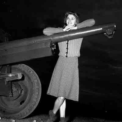 Woman posing on an artillery piece