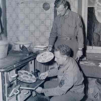 Soldiers using "liberated" French stove