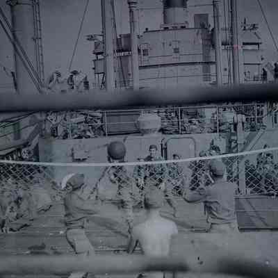 Soldiers playing volleyball on ship