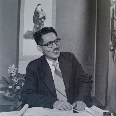 Portrait of Japanese man seated at desk