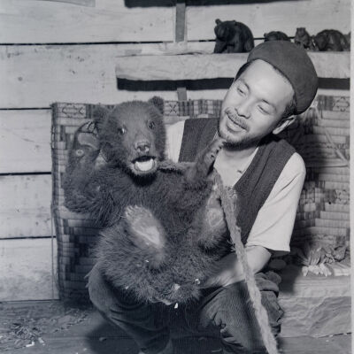 Ainu man with a pet bear