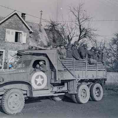 German prisoners riding in the back of truck
