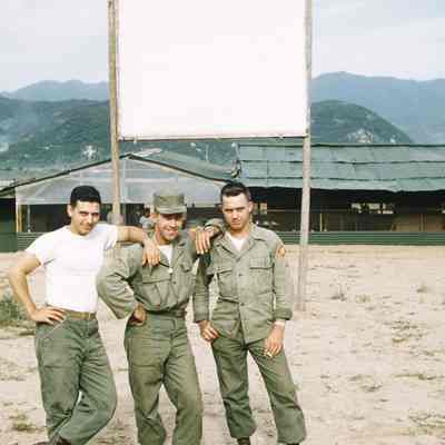 Three soldiers pose for a picture