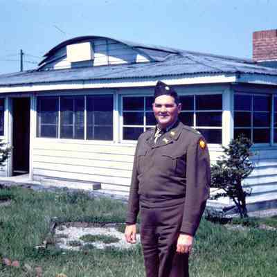 Soldier in front of building