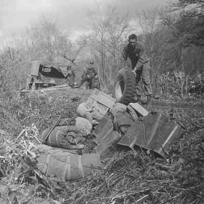 Soldier unloading equipment from the back of a truck