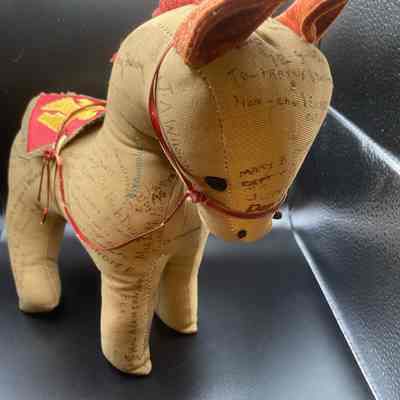 Stuffed animal horse with soldier signatures