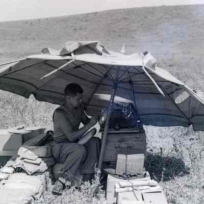 Soldier under umbrella