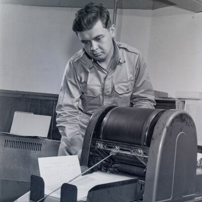 Soldier operating a mimeograph machine