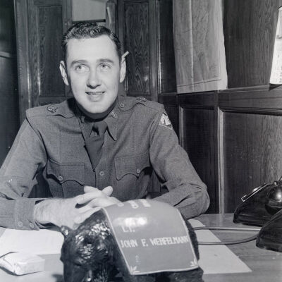 John F. Werfelmann at his desk