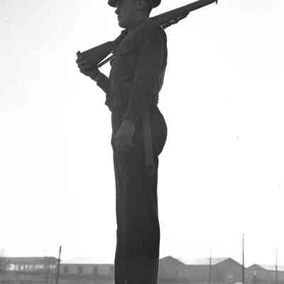 Soldier shouldering his rifle