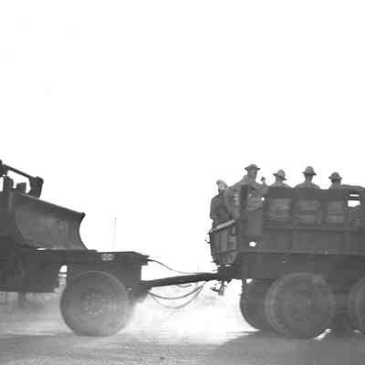 Truck pulling dozer