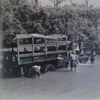 Soldiers washing truck