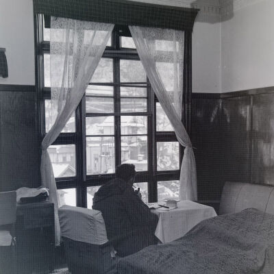 Soldier smoking in hotel room