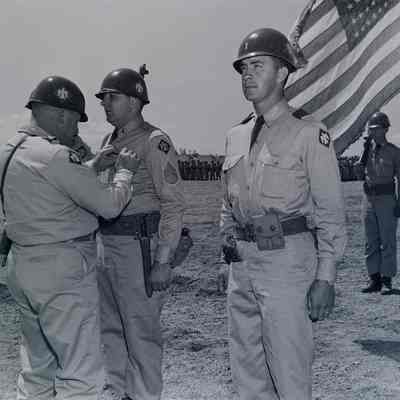 Soldiers receiving decoration on parade ground