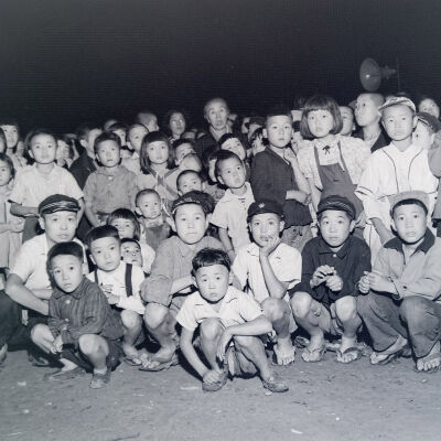 Night photo of a large group of young Japanese children