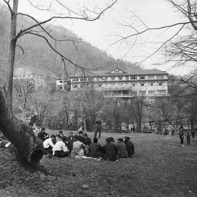 Group of Japanese civilians with the Noboribetsu Hotel in the background