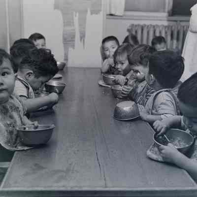 Group of Japanese children eating at a table