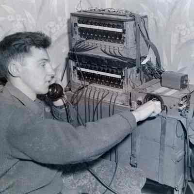 Soldier operating a captured German switchboard