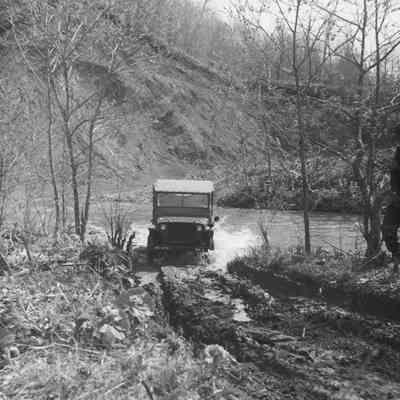 Jeep crossing stream