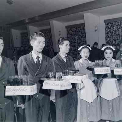 Japanese waitstaff with cocktail trays