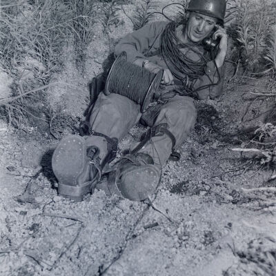 Soldiers stringing wire