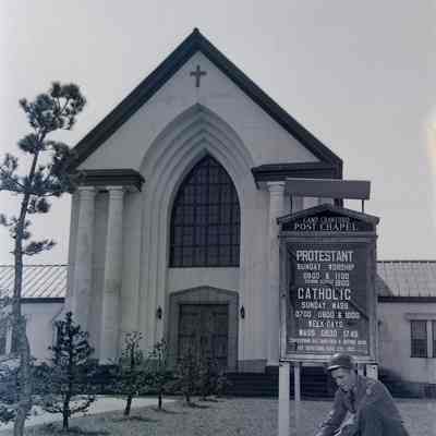 Soldier changing the sign outside of church