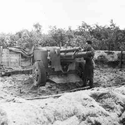 Soldier working on artillery piece