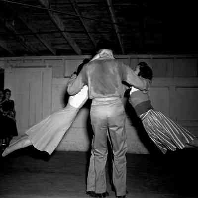 Soldier dancing with girls