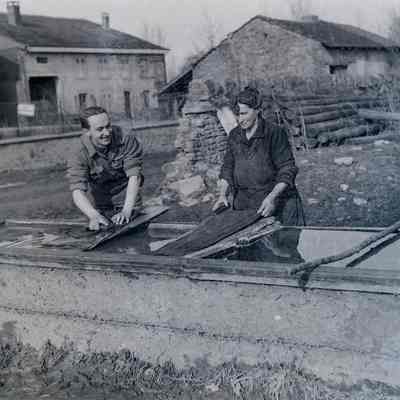 Soldier and civilian washing their clothes