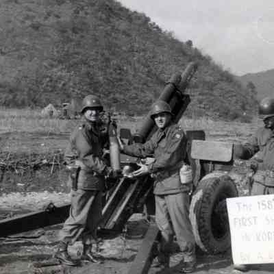 Soldiers holding Artillery Shell