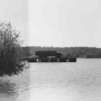 Truck parked on pontoon bridge section