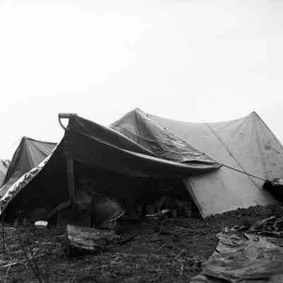 Pup tent rigged with rain fly