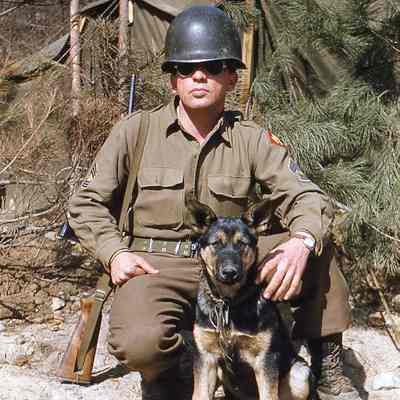 Soldier posing with dog
