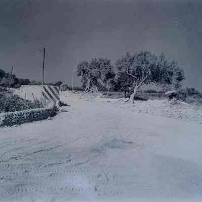 Road junction with remains of Italian pillbox