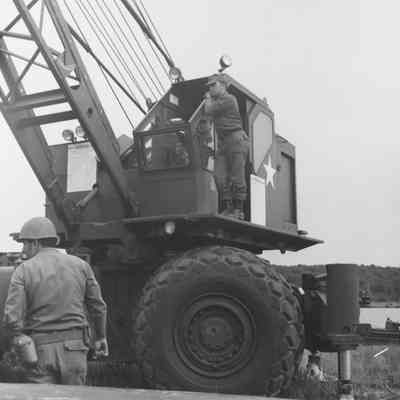 Soldiers training to construct a pontoon bridge
