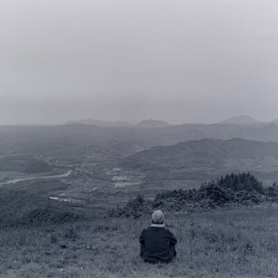 Civilian viewing a mountain landscape
