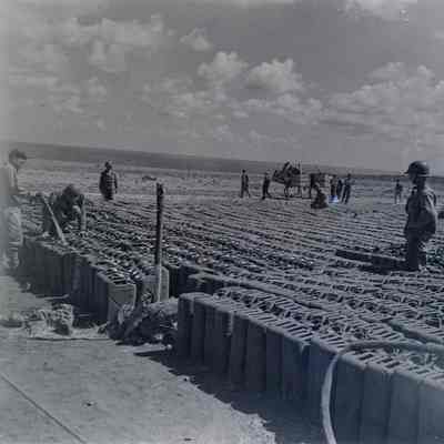 Water cans being filled in preparation of the invasion of Italy