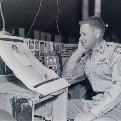 Portrait of a soldier with pin-up art