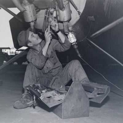 Soldier working on light aircraft