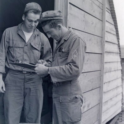 Two soldiers in a warehouse