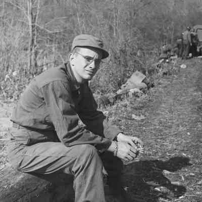 Soldier sitting on a log